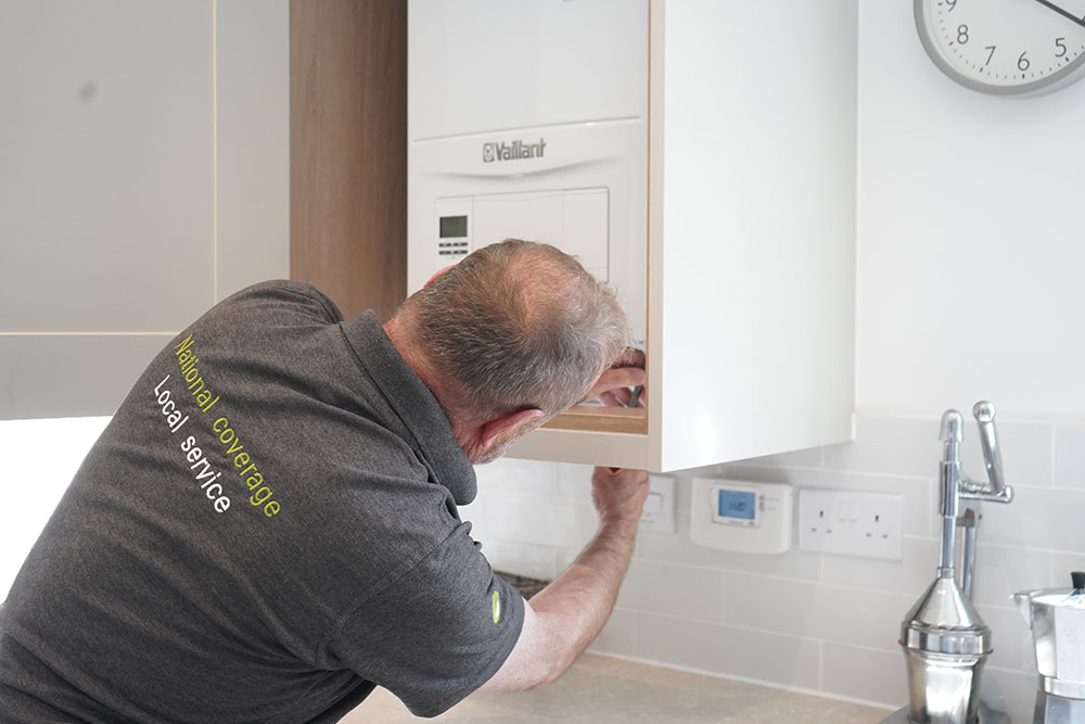 Heat Care UK engineer installing a boiler