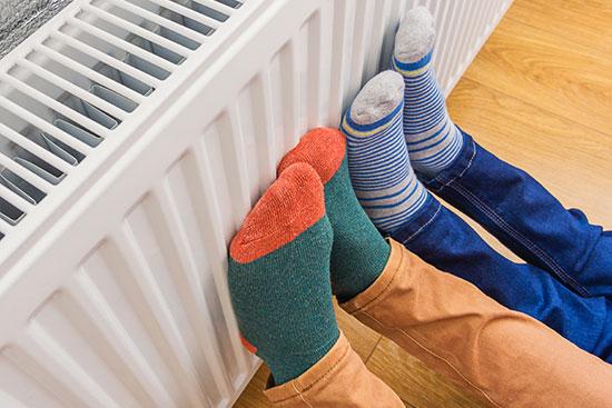 Feet against a radiator